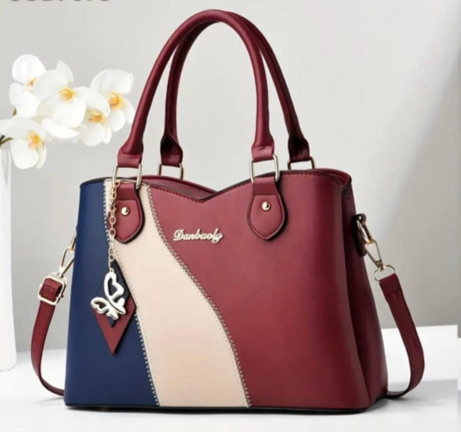 BOLSO DE MANO, CORREA AJUSTABLE CON DISEÑO DE BLOQUE DE COLORES