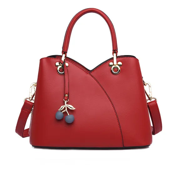 BOLSO  CON CORREA AJUSTABLE  DISEÑO COQUETO Y ELEGANTE